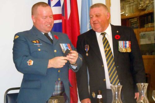 Legion vice president Jeff Donelly (right) presents Warrant Officer Joe Kiah with a gift at the annual Veterans Dinner at the Sharbot Lake Legion